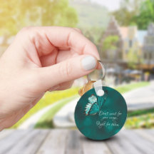 Sleutelhanger van Turquoise en zwarte vlinder