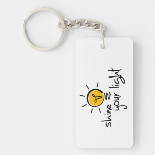 Slogan shine your light. laat je licht schijnen. sleutelhanger
