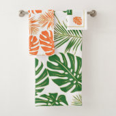 Smaragdgroene, oranje tropische bladeren en monogr bad handdoek (Insitu)