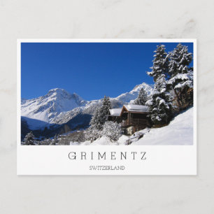 Sneeuw bedekte blokhutten in Zwitserland Briefkaart
