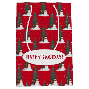 sneeuwman en hert in sneeuwvlokken op rood medium cadeauzakje