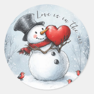 Sneeuwman geeft liefde met een groot hart ronde sticker
