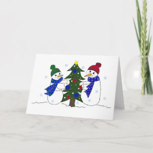 Sneeuwmannen versieren een kerstboom feestdagen kaart