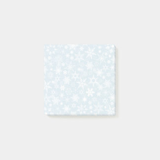 Sneeuwvlokken op blauw post-it® notes