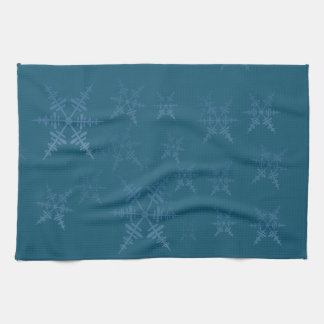 Sneeuwvlokken op donkerblauwe keukenhanddoek