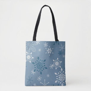 Sneeuwvlokken op een blauwe achtergrond tote bag