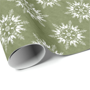 Sneeuwvlokken op groen cadeaupapier