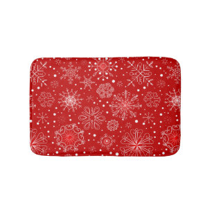 Sneeuwvlokken op rode achtergrond badmat