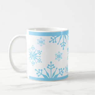 Sneeuwvlokpatroon in blauw. koffiemok
