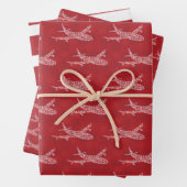 Sneeuwvlokvliegtuig op rood. Papieren pakbladen Inpakpapier Vel (In situ)