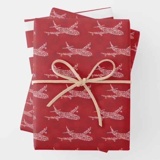 Sneeuwvlokvliegtuig op rood. Papieren pakbladen Inpakpapier Vel (In situ)
