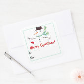 Snowman met kerstcadeaulabel met hart en ziel vierkante sticker (Envelop)