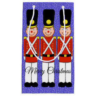 Soldats de Noël avec sac cadeau de neige