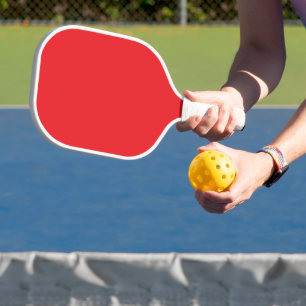 Solide rode achtergrond pickleball paddle
