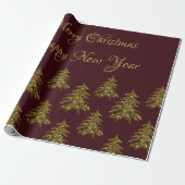 Sparkly gouden kerstboom op rode kerst cadeaupapier (Uitgerold)