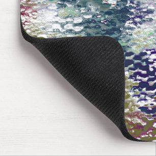 Spatten en splatten van verf onder gehamerd glas muismat