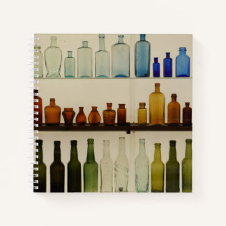 Spiraal notitieboek met glazen fles ontwerp