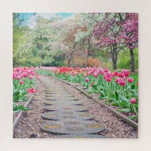 Springtime Flowers Along Stone Walkway Legpuzzel