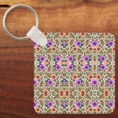 Square keychain showcasing a vibrant floral  (Voorkant)