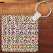 Square keychain showcasing a vibrant floral  (Achterkant)