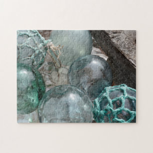 Stapel glazen visdobbers legpuzzel