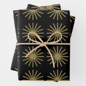 Starburst patroon zwart en goud inpakpapier vel (In situ)
