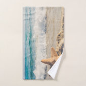 Starfish sur une plage de sable Photo (Serviette à main)