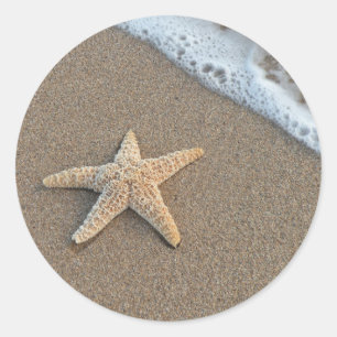 Starvis op het strand ronde sticker
