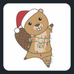 Sticker Carré Beaver Cheerful<br><div class="desc">The beaver at Christmas with fairy lights. Funny animals with toxits and snow for the holidays. Donc Funny for Christmas in July. Beavers are cute animals and perfect for Christmas.</div>