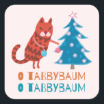 Sticker Carré Chat Trimming the Christmas Tree<br><div class="desc">Le chat tabby rouge orne son sapin de Noël. Le texte ci-dessous indique O Tabbybaum. Un autocollant mignon pour les chaises et les amoureux de les chats.</div>