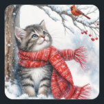 Sticker Carré Christmas Kitty Regarder un cardinal<br><div class="desc">Un chaton moelleux portant une écharpe rouge d'hiver en contemplant un cardinal perché sur une branche enneigée.</div>