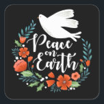 Sticker Carré Christmas Peace on Earth Script<br><div class="desc">Un joli autocollant de Noël avec une colombe dans une couronne fleurie avec les mots Paix sur Terre dans une police de caractères élégante. L'autocollant de Noël est conçu en noir,  blanc et rouge. Conçu pour vous par Blackberry Boulevard.</div>