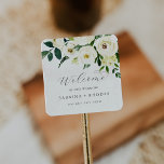 Sticker Carré Elégant Mariage Floral Blanc Bienvenue<br><div class="desc">Ces élégants stickers de mariages à fleurs blanches sont parfaits pour un mariage classique. Le design vintage moderne présente de magnifiques rose de couleur d'ivoire et crème et des fleurs de pivoine avec des feuilles vert foncé, de la verdure et des botaniques. Personnalisez ces autocollants avec l'emplacement de votre mariage,...</div>