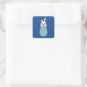 Sticker Carré Joli lapin blanc tenant l'oeuf de Pâques