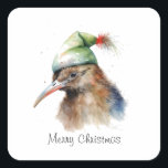 Sticker Carré Kiwi de Noël cosy, coutume<br><div class="desc">Ajoutez une touche unique de fête personnalisée à presque tout avec notre autocollant personnalisable "Cosy Christmas Kiwi"! Cet autocollant plein de vitalité présente un design d'aquarelle charmant d'un kiwi lunatique portant un casquette d'hiver vert, apportant un mélange unique de charme néo-zélandais et esprit festif à vos effets personnels. C'est la...</div>