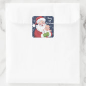 Sticker Carré Le Père Noël tient un bébé 1er Noël (Sac)