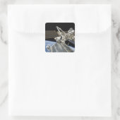 Sticker Carré Les astronautes effectuent une série de tâches (Sac)