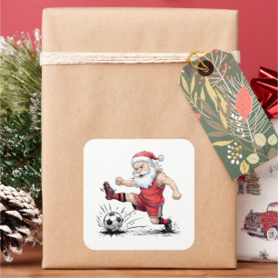 Sticker Carré Père Noël musculaire de football frappant le ballo