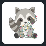 Sticker Carré Raccoon<br><div class="desc">Les Racon to softness with fairy lights. Funny animals with toxits and snow to the holidays. Donc Funny for Christmas in July. Raccoons are sweet animals and perfect for Christmas.</div>
