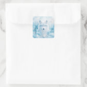 Sticker Carré White Wolf Portrait with Blue Eyes in Snowy Forest (Sac)