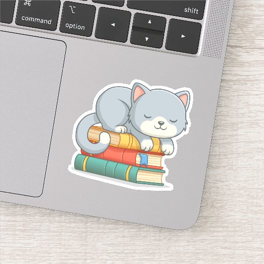 Sticker Chat mignon au-dessus de la pile de livres (Détail)