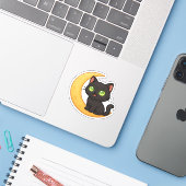 Sticker Chat noir souriant aux yeux verts brillants assis (Ordinateur portable avec iPhone)