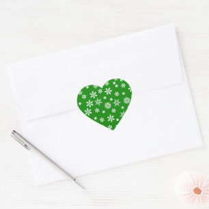 Sticker Cœur Les flocons blancs sur le Arrière - plan vert