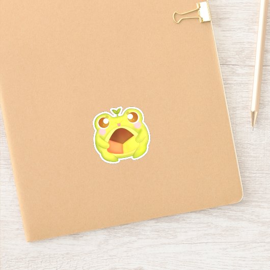 Sticker Cute Grenouille verte tenant le biscuit Polvoron m (Carnet)