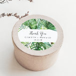 Sticker de Merci de palme Tropical Sauvage Faveur<br><div class="desc">Ces stickers de faveur palmier tropical sauvage vous remercient mariage sont parfaits pour une réception de mariage plage ou destination. Le design comprend un éventail exotique de feuilles de bananiers d'aquarelle verte, fougères, feuillage, plantes botaniques et verdure pour une sensation tropicale estivale. Personnalisez les étiquettes autocollants avec vos noms, l'événement...</div>