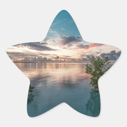 Sticker Étoile blue sky with red and dark clouds reflected on sea (Devant)