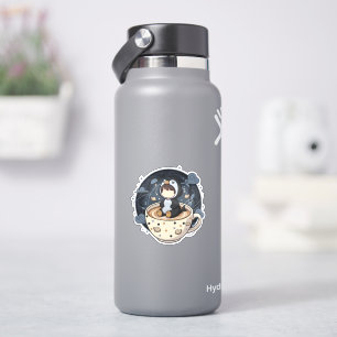 Sticker Manchot lisant avec une tasse chaude