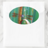 Sticker Ovale A teal Eyed Dragonfly with cattails (Sac)