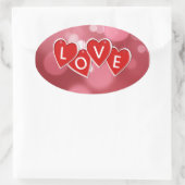 Sticker Ovale Amour marquant avec des lettres les coeurs rouges (Sac)