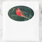 Sticker Ovale Cardinal d'hiver en tempête de neige - Amélioré (Sac)